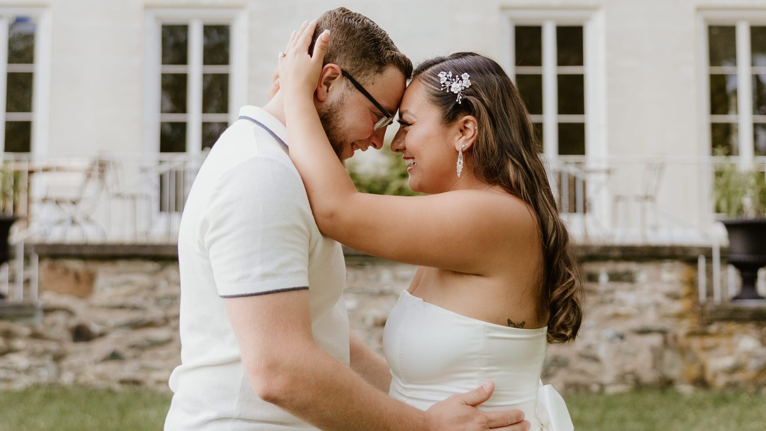 A couple embracing during their engagement session at the Home of Franklin D. Roosevelt National Historic Site in Hyde Park, New York.