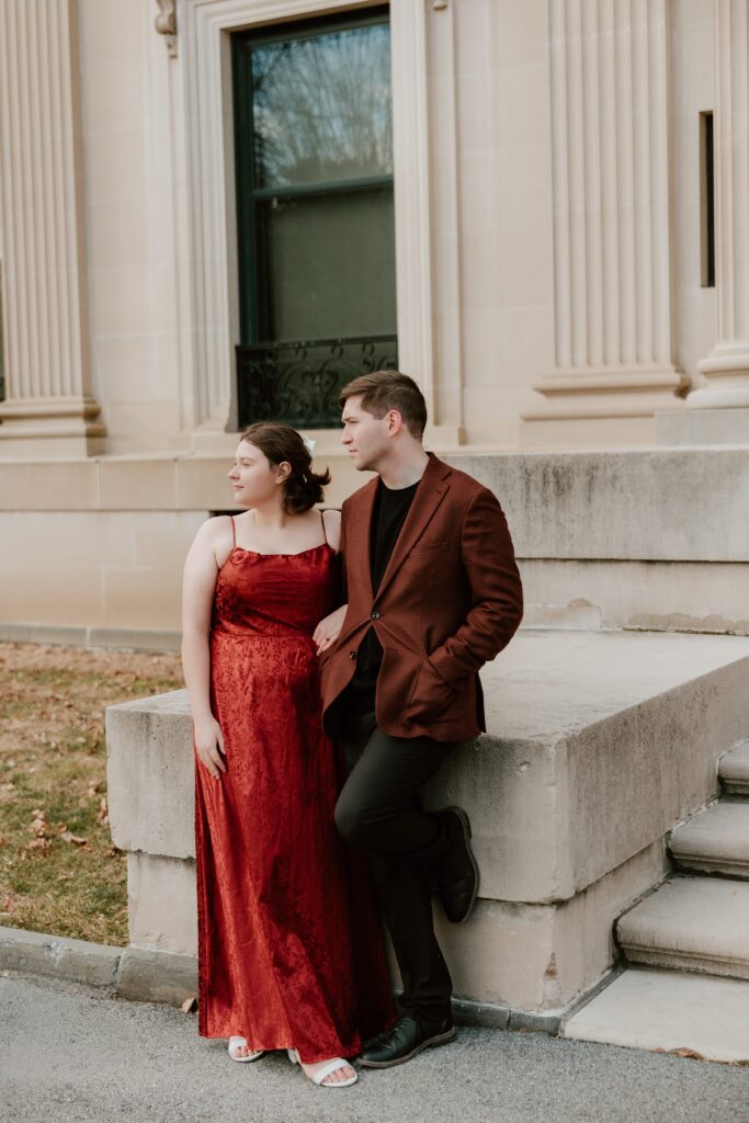 A couple standing elegantly by the historic steps of Vanderbilt Mansion during their Hudson Valley couples session, showcasing timeless architecture.