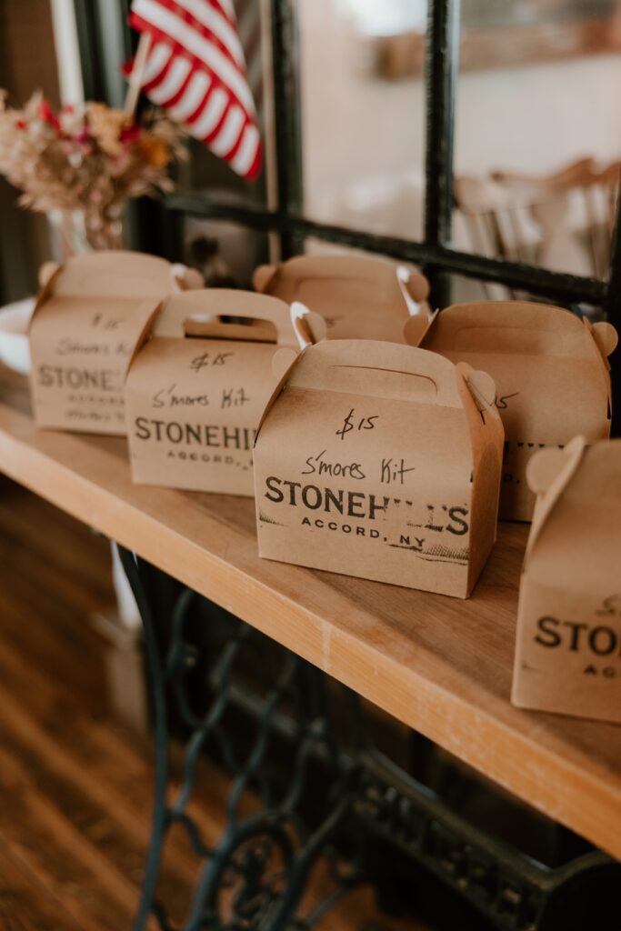 Stonehill’s Farmhouse s’mores kits displayed in boxes for guests at Hudson Valley wedding in Accord, NY.
