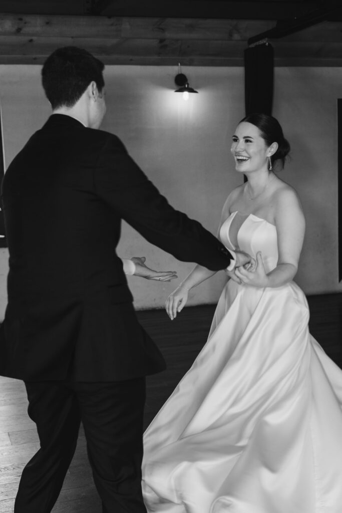 photo of bride and groom dancing together during their wedding at Drowned Lands Brewery in Warwick NY