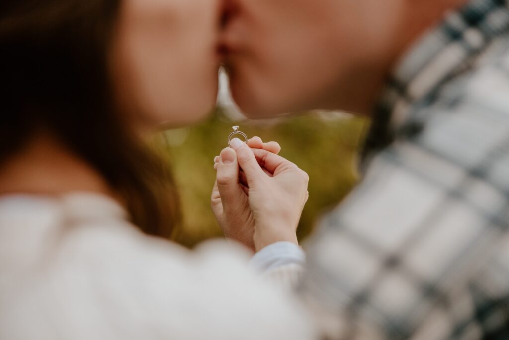 Close-up of an engagement ring during a couples photo session at Long Dock Park in Beacon, NY.